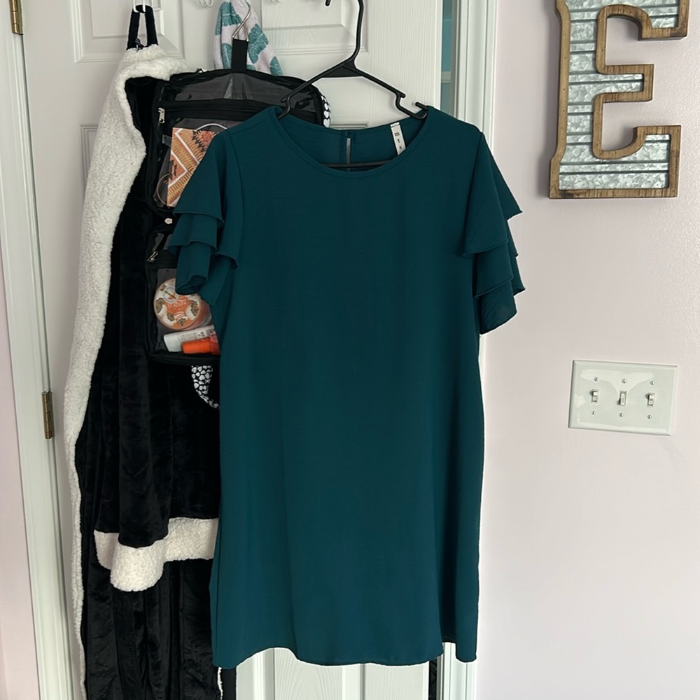 Teal dress with ruffled sleeves